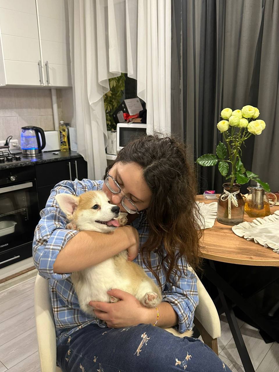 Jane Smith smiling with her Royal Coogies Corgi puppy